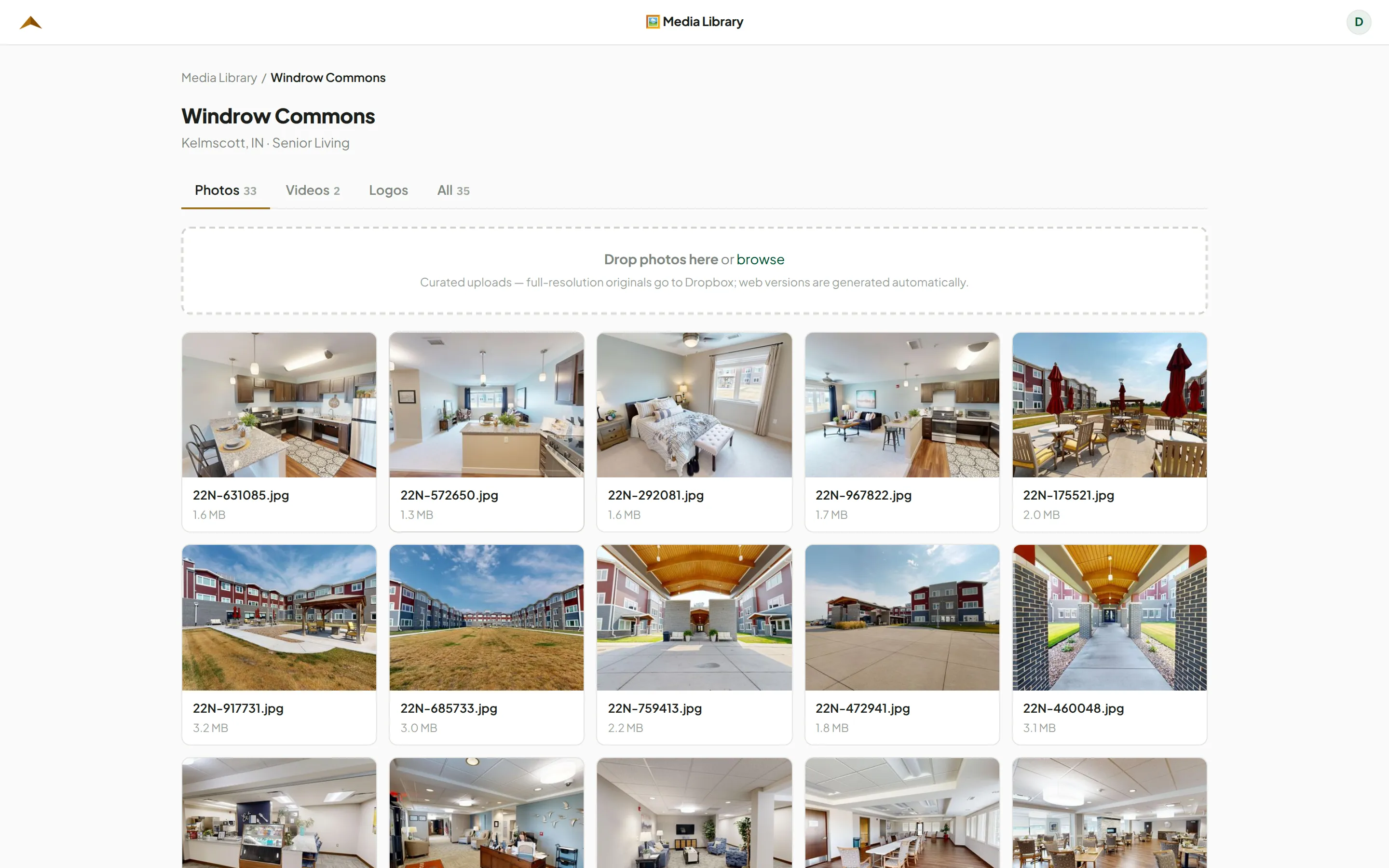 One project — 33 photos and 2 videos — with the drag-and-drop target above them.